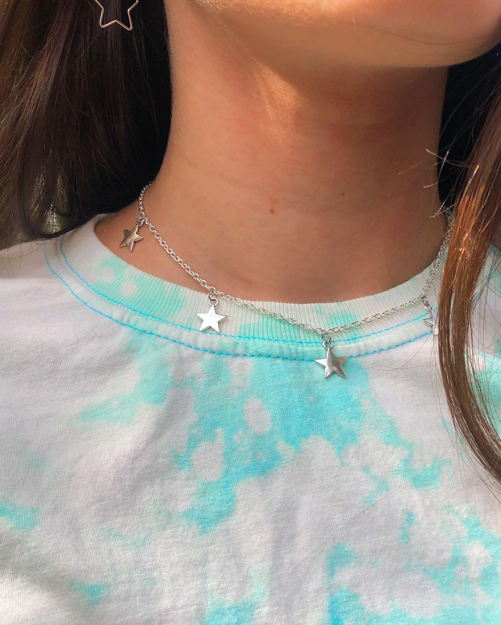 handmade silver star necklace and blue bleached t-shirt